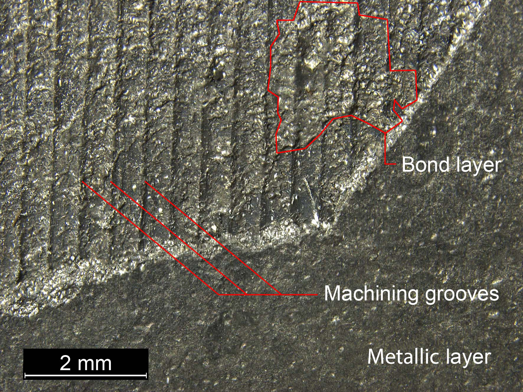 Close up of the metallic surface layer with key elements highlighted
